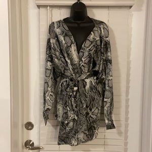 Snakeskin wrap blouse. Smoke free and pet free home. Brand new with tags.